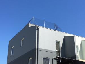 Elevated Bird Netting to Apartment Roof